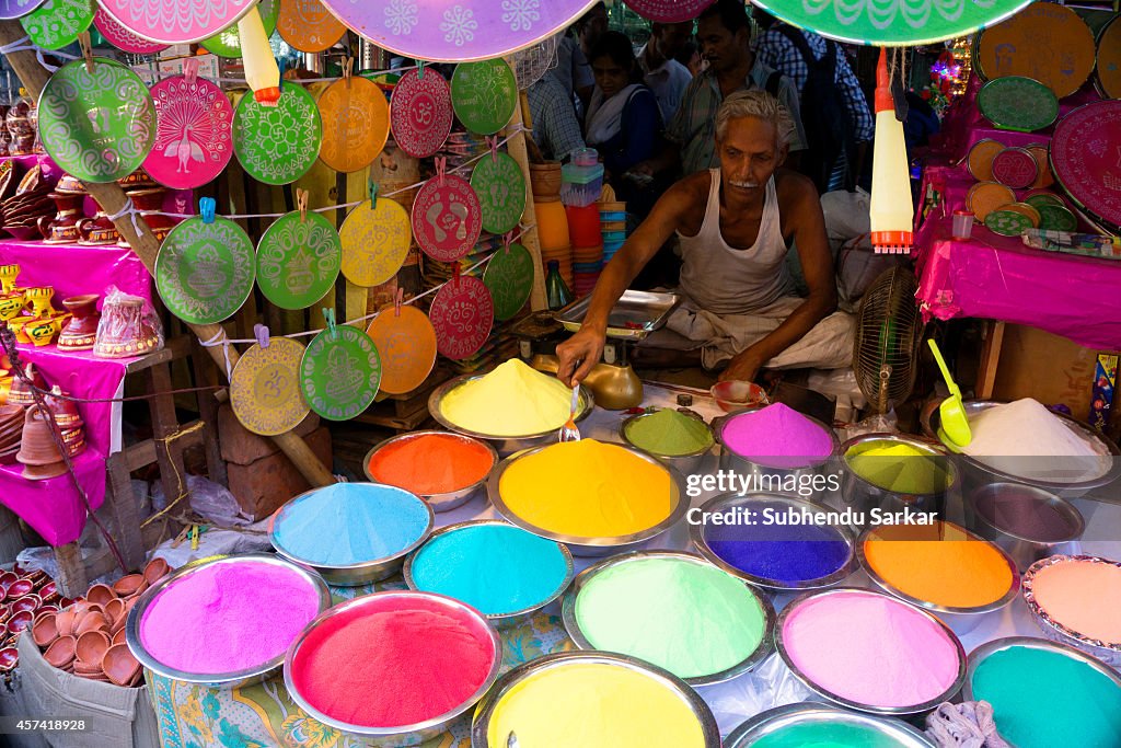 A man sells colored powder in Burra Bazaar. Burra Bazaar (...