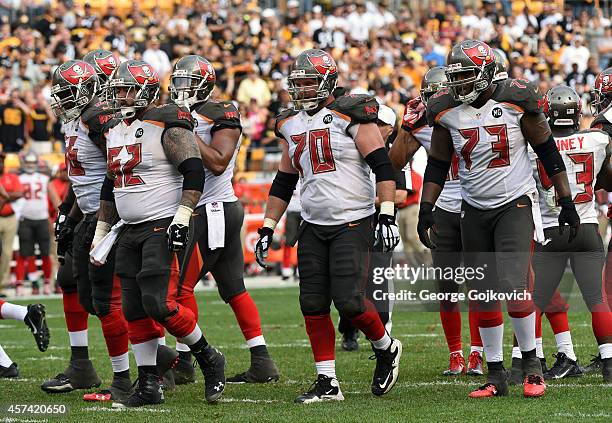 The offensive line of the Tampa Bay Buccaneers, including guard Patrick Omameh, center Evan Dietrich-Smith, guard Logan Mankins and tackle Anthony...