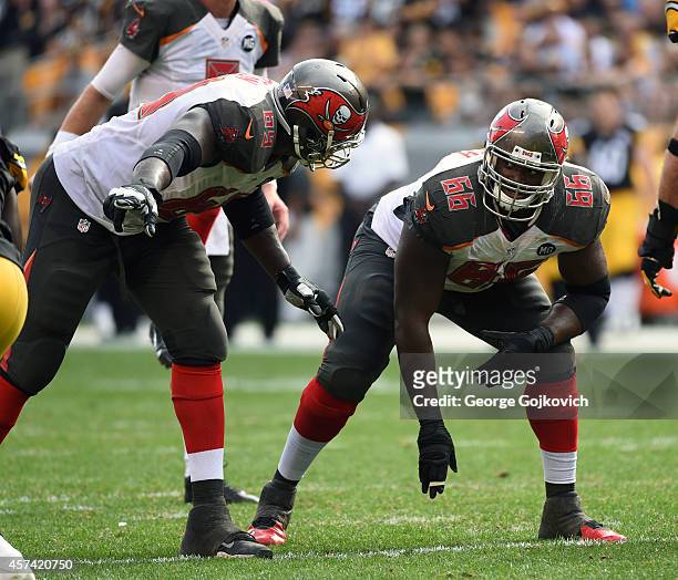 Guard Patrick Omameh of the Tampa Bay Buccaneers looks at tackle Demar Dotson at the line of scrimmage during a game against the Pittsburgh Steelers...