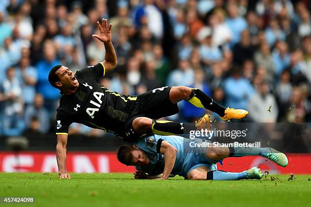 Etienne Capoue of Spurs is tackled by James Milner of Manchester City during the Barclays Premier League match between Manchester City and Tottenham...