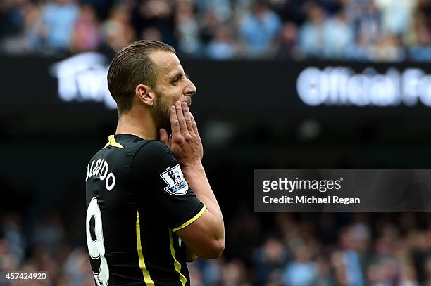 Roberto Soldado of Spurs reacts after missing with his penalty attempt during the Barclays Premier League match between Manchester City and Tottenham...