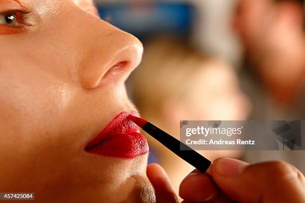 Model prepares for the Seyma Subasi show during Mercedes Benz Fashion Week Istanbul SS15 at Antrepo 3 on October 18, 2014 in Istanbul, Turkey.