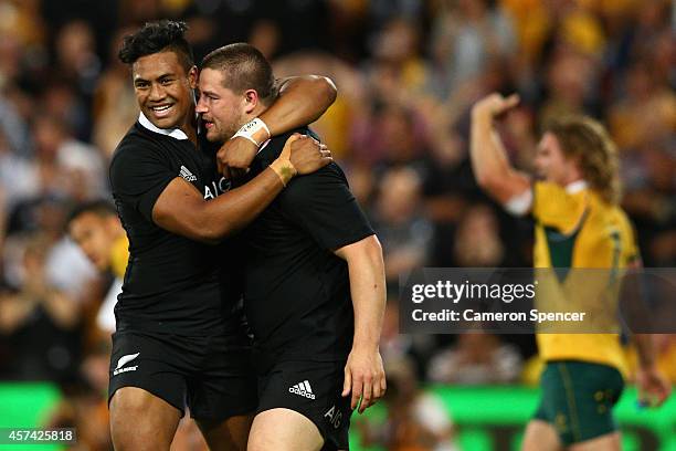 Dane Coles of the All Blacks is congratulated by team mate Julian Savea after scoring a try during The Bledisloe Cup match between the Australian...