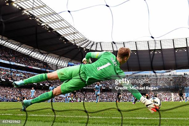 Goalkeeper Joe Hart of Manchester City saves the penalty attempt from Roberto Soldado of Spurs during the Barclays Premier League match between...