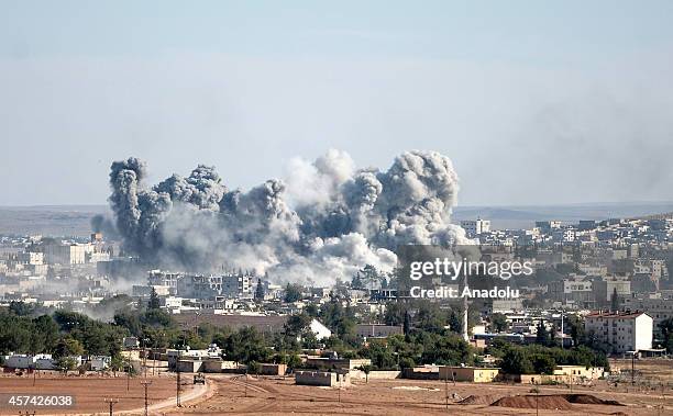 Photograph taken from Suruc district of Sanliurfa, Turkey, shows smoke rising from the Syrian border town of Kobani following the US-led coalition...