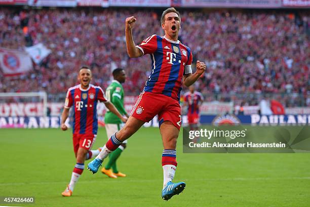 Philipp Lahm of Bayern Muenchen celebrates scoring the opening goal during the Bundesliga match between FC Bayern Muenchen and SV Werder Bremen at...