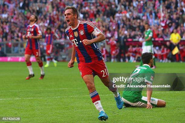 Philipp Lahm of Bayern Muenchen celebrates scoring the opening goal during the Bundesliga match between FC Bayern Muenchen and SV Werder Bremen at...