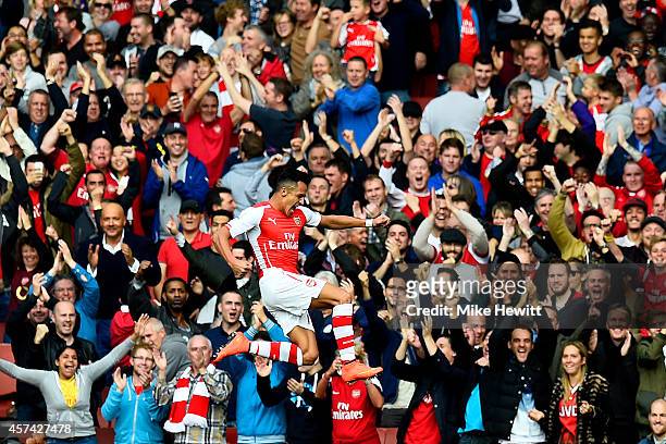Alexis Sanchez of Arsenal celebrates after scoring the opening goal during the Barclays Premier League match between Arsenal and Hull City at...