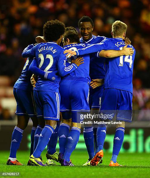 Frank Lampard of Chelsea celebrates with team mates after the opening goal during the Capital One Cup Quarter-Final match between Sunderland and...