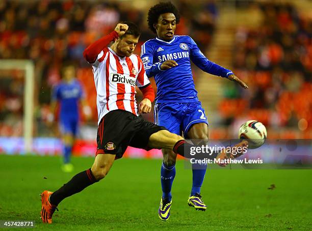 Ondrej Celustka of Sunderland controls the ball under pressure from Willian of Chelsea during the Capital One Cup Quarter-Final match between...