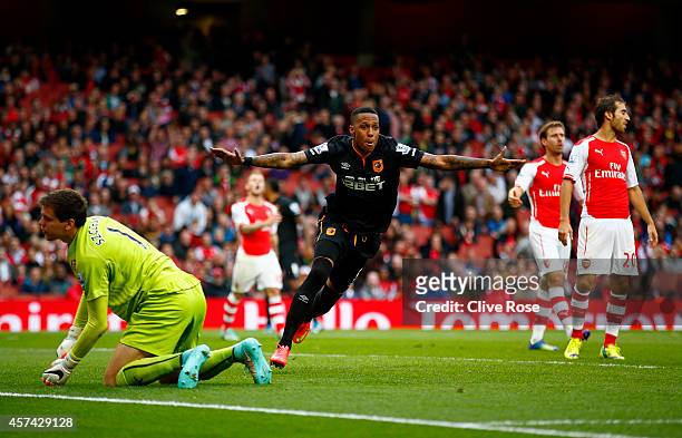 Abel Hernandez of Hull City celebrates after scoring his team's second goal during the Barclays Premier League match between Arsenal and Hull City at...