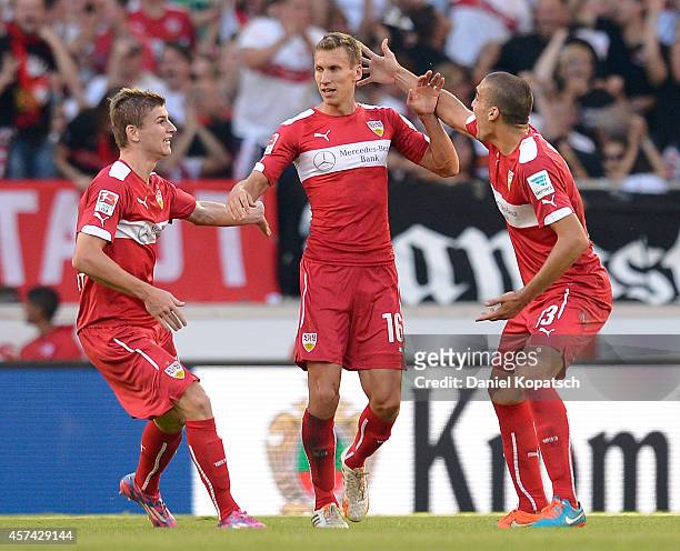 Florian Klein of Stuttgart celebrates his team's second goal with team mates Timo Werner and Romeu Oriol during the Bundesliga match between VfB...