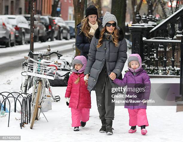 Sarah Jessica Parker is seen walking her twin daughters, Tabitha Broderick and Loretta Broderick, to school on December 17, 2013 in New York City.