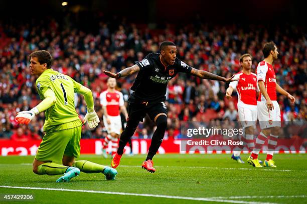 Abel Hernandez of Hull City celebrates after scoring his team's second goal during the Barclays Premier League match between Arsenal and Hull City at...