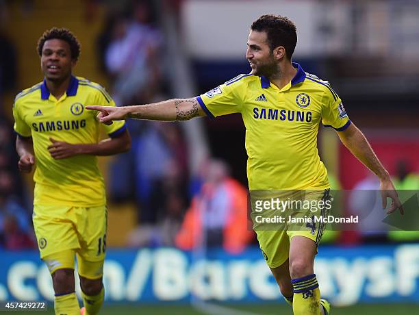 Cesc Fabregas of Chelsea celebrates with Loic Remy as he scores their second goal during the Barclays Premier League match between Crystal Palace and...