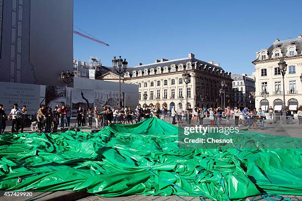 The controversial inflatable sculpture "Tree" by US artist Paul McCarthy sits deflated at Place Vendome on October 18, 2014 in Paris, France. An...