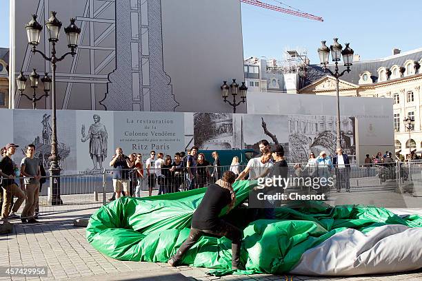 The controversial inflatable sculpture "Tree" by US artist Paul McCarthy sits deflated at Place Vendome on October 18, 2014 in Paris, France. An...