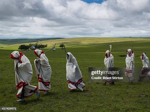 Xhosa Initiates pass by close to the funeral of Nelson Mandela, Qunu, South Africa, 14 December 2014. These initiates have recently been circumsized...