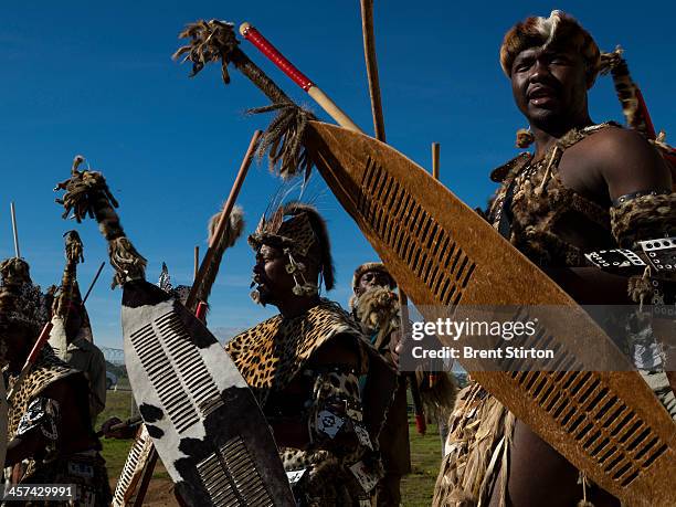 Traditionally dressed warrior dancers prepare to board buses to dance for the Nelson Mandela funeral dignitaries, Qunu, South Africa, 14 December...