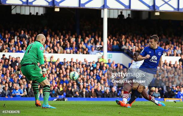 Seamus Coleman of Everton scores their third goal past Brad Guzan of Aston Villa during the Barclays Premier League match between Everton and Aston...