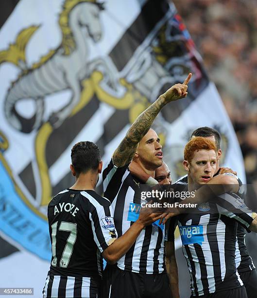 Newcastle player Gabriel Obertan celebrates his goal with team mates during the Barclays Premier League match between Newcastle United and Leicester...