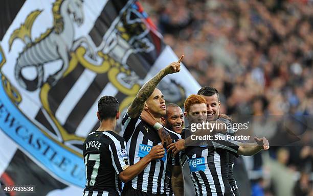 Newcastle player Gabriel Obertan celebrates his goal with team mates during the Barclays Premier League match between Newcastle United and Leicester...