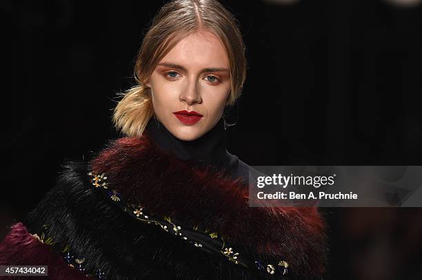 Model walks the runway at the Seyma Subasi show during Mercedes Benz Fashion Week Istanbul SS15 at Antrepo 3 on October 18, 2014 in Istanbul, Turkey.