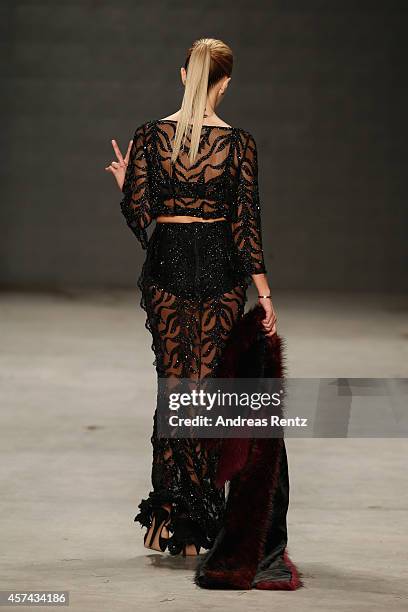 Model walks the runway at the Seyma Subasi show during Mercedes Benz Fashion Week Istanbul SS15 at Antrepo 3 on October 18, 2014 in Istanbul, Turkey.