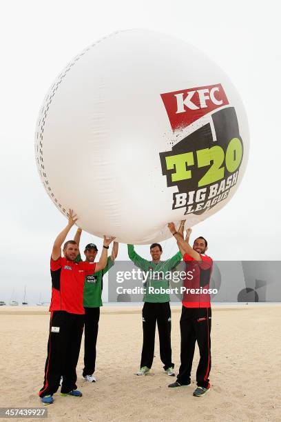 Aaron Finch and Fawad Ahmed of the Melbourne Renegades along with Glenn Maxwell and Clint McKay of the Melbourne Stars pose for photos during the BBL...