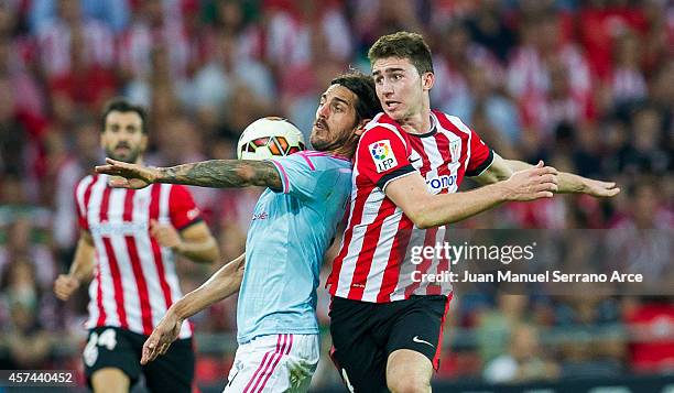 Aimeric Laporte of Athletic Club duels for the ball with Joaquin Larrivey of Celta de Vigo during the La Liga match between Athletic Club and Celta...