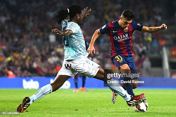 Munir El Haddadi of FC Barcelona duels for the ball with Derek Boateng of SD Eibar during the La Liga match between FC Barcelona and SD Eibar at Camp...