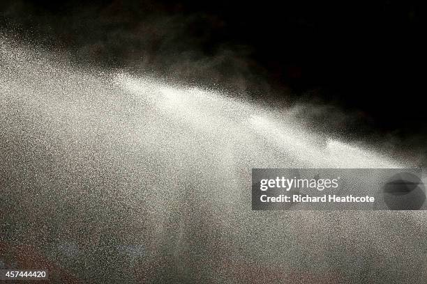 Water is sprayed over the pitch before the start during the Barclays Premier League match between Southampton and Sunderland at St Mary's Stadium on...