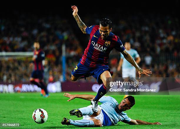 Dani Alves of FC Barcelona duels for the ball with Dani Garcia of SD Eibar during the La Liga match between FC Barcelona and SD Eibar at Camp Nou on...