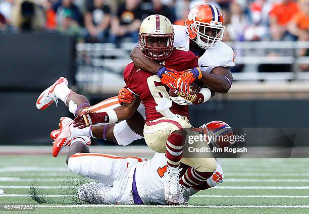 Sherman Alston of the Boston College Eagles is brought down by Tony Steward of the Clemson Tigers in the first half against the Clemson Tigers at...