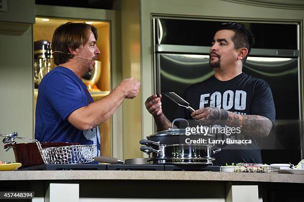 Chefs John Besh and Aaron Sanchez give a cooking demonstration at the Grand Tasting presented by ShopRite featuring KitchenAid® culinary...