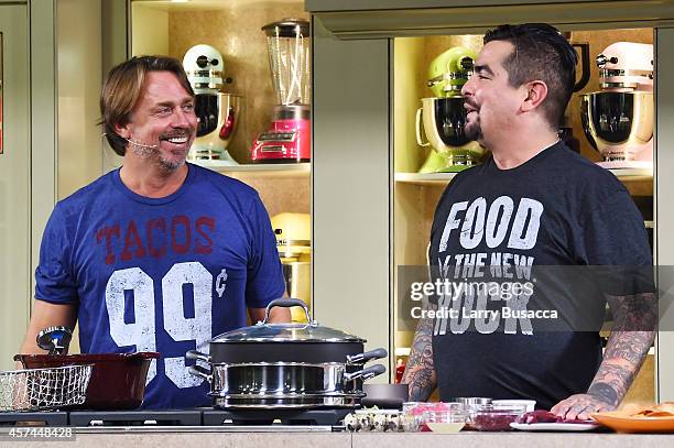 Chefs John Besh and Aaron Sanchez give a cooking demonstration at the Grand Tasting presented by ShopRite featuring KitchenAid® culinary...