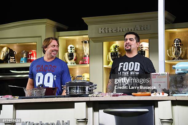 Chefs John Besh and Aaron Sanchez give a cooking demonstration at the Grand Tasting presented by ShopRite featuring KitchenAid® culinary...