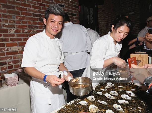 Hung Huynh of Catch serves oysters at The Lobster Place Presents Oyster Bash sponsored by Negra Modelo hosted by Tyler Florence during the Food...