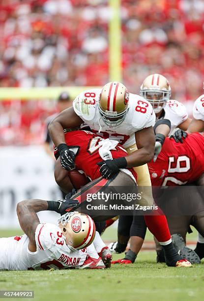 NaVorro Bowman and Demarcus Dobbs of the San Francisco 49ers tackles Bobby Rainey of the Tampa Bay Buccaneers during the game at Raymond James...