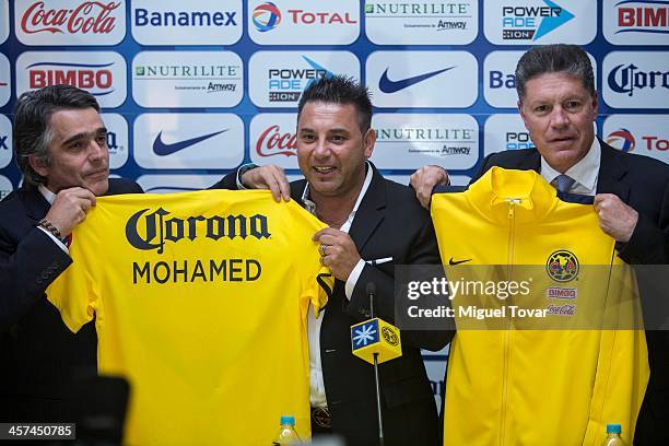 Jose Romano president of America Futbol Club, Argentinian coach Antonio Mohamed and Ricardo Pelaez sports President of America apose for a photo...