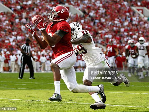 Amari Cooper of the Alabama Crimson Tide pulls in this reception for a touchdown against Deshazor Everett of the Texas A&M Aggies at Bryant-Denny...