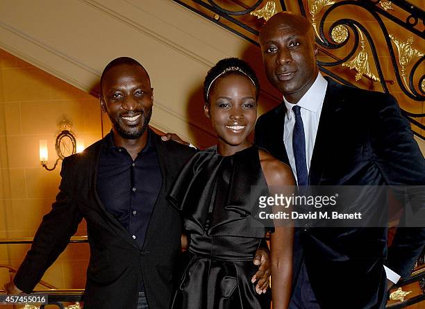 Gordon Hagan, Lupita Nyong'o and Ozwald Boateng attend the Sindika Dokolo Art Foundation dinner at Cafe Royal on October 18, 2014 in London, England.