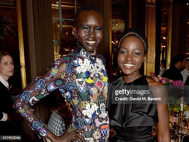 Alex Wek and Lupita Nyong'o attend the Sindika Dokolo Art Foundation dinner at Cafe Royal on October 18, 2014 in London, England.