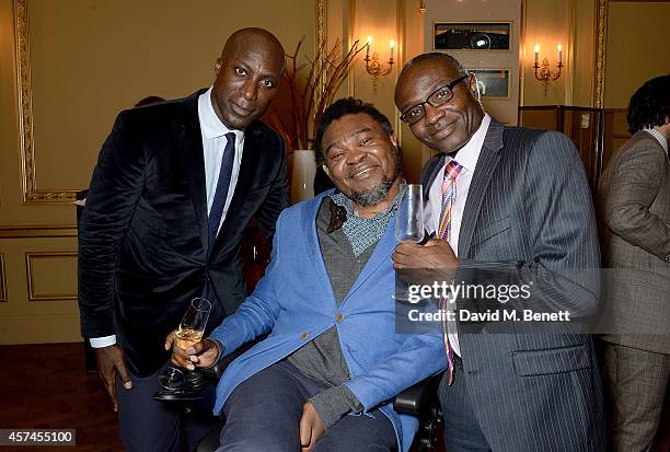 Ozwald Boateng, Yinka Shonibare and Oladele Bamgboye attend the Sindika Dokolo Art Foundation dinner at Cafe Royal on October 18, 2014 in London,...