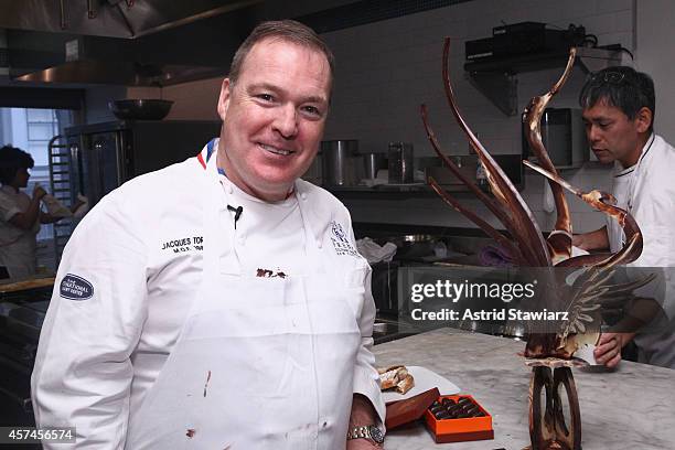 Master pastry chef Jacques Torres poses with food at Candy Making Master Class hosted by Jacques Torres during the Food Network New York City Wine &...