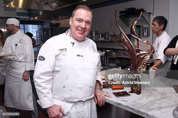 Master pastry chef Jacques Torres poses with food at Candy Making Master Class hosted by Jacques Torres during the Food Network New York City Wine &...