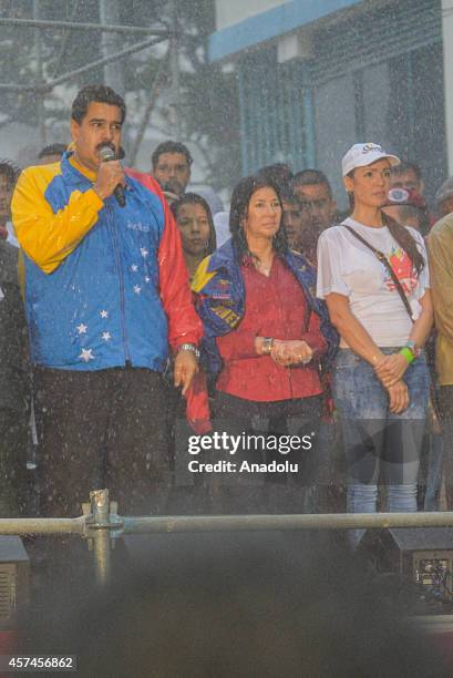 Venezuelan President Nicolas Maduro delivers a speech about claims of lawmaker Robert Serra murder during a demonstration in Caracas, on October 18,...