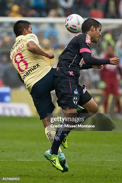 Moises Velasco of America fights for the ball with Severo Meza of Monterrey during a match between America and Monterrey as part of 13th round...