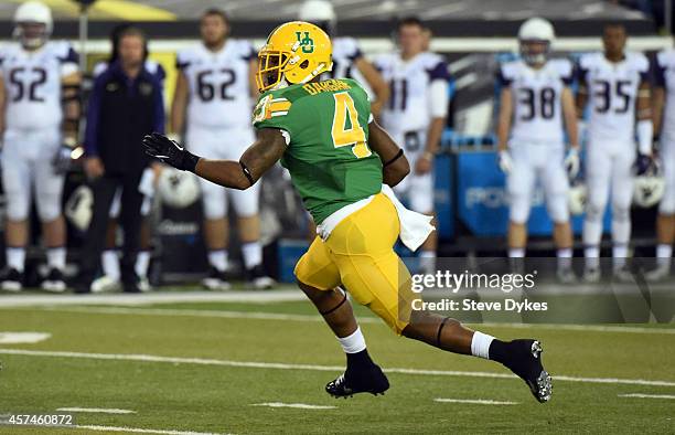 Defensive back Erick Dargan of the Oregon Ducks runs back an interception during the second quarter of the game against the Washington Huskies at...