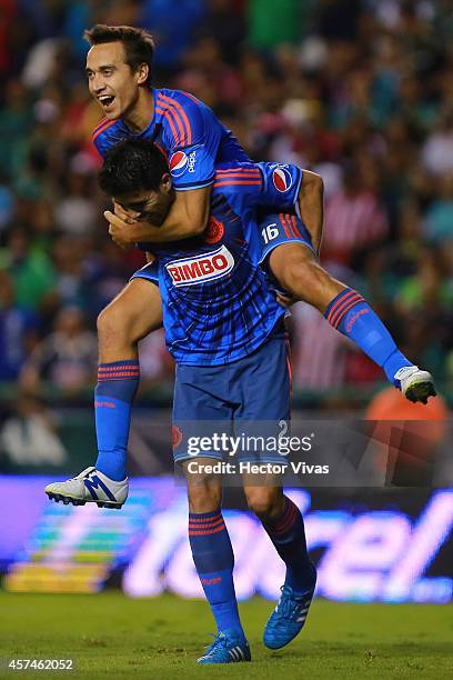 Nestor Vidrio of Chivas celebrates with Gerardo Rodriguez after scoring the first goal of his team during a match between Leon and Chivas as part of...